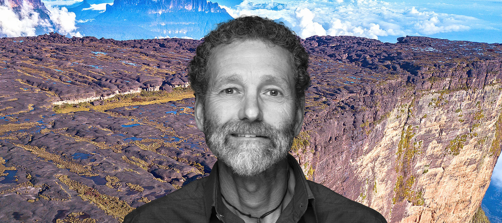 Dr Philippe Kok against the background of a monumental plateau 