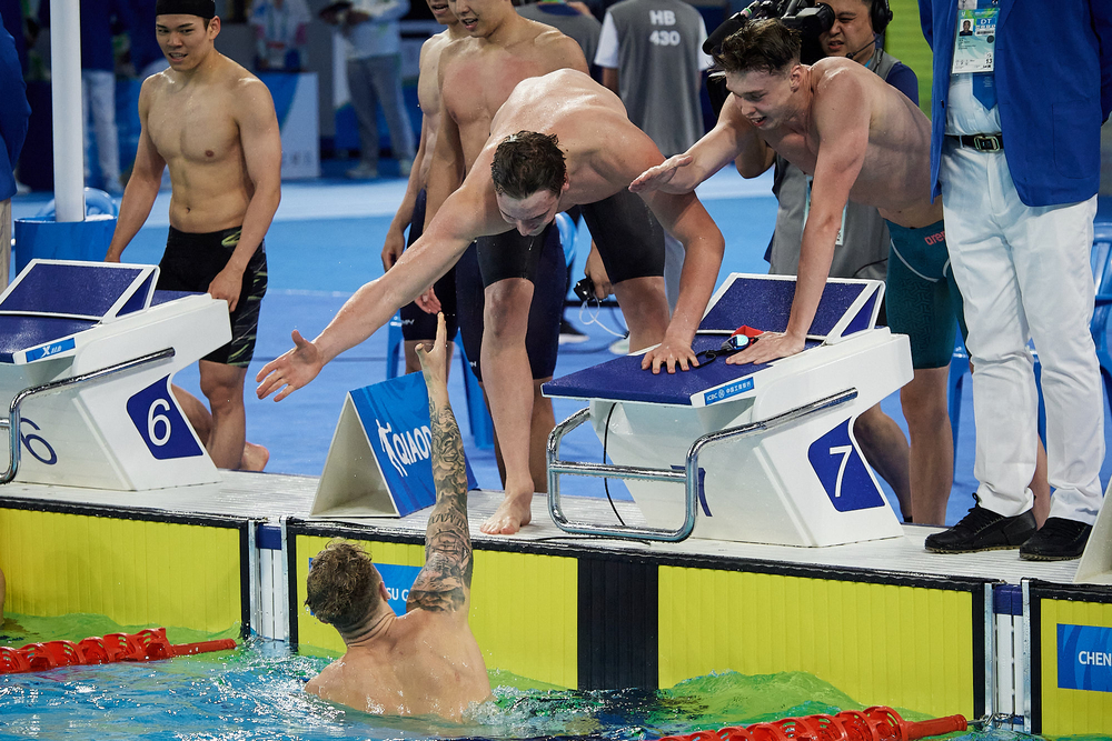Jakub Kraska, Kamil Sieradzki, Dominik Dudys enjoying themselves by the pool after the race