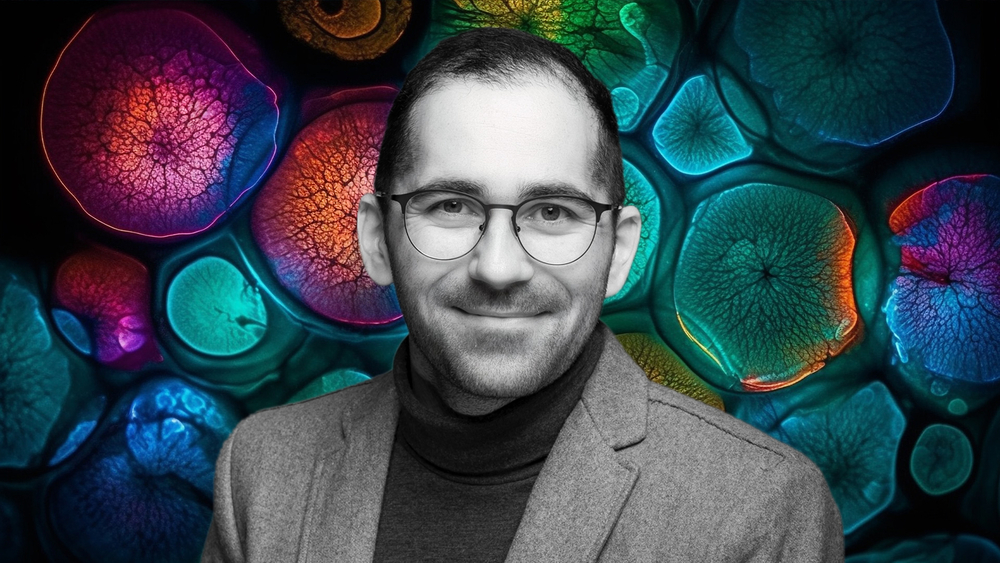 Dr Damian Jacenik on the background of a collage of colorful cells
