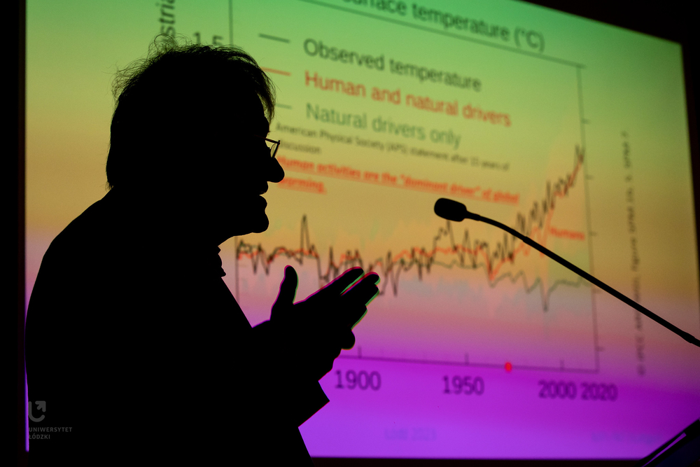 Professor Klaus von Klitzing on a background of a graph illustrating a global temperature rise