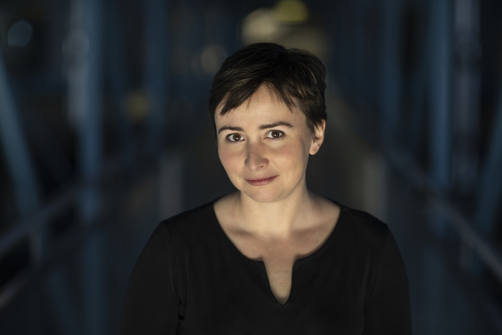 A portrait photo of Dr Agata Zysiak on a dark background